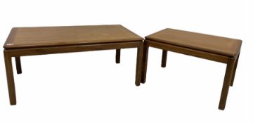 G-Plan -A Mid century teak coffee table with cross banded top raised on square supports (106cm x 62c