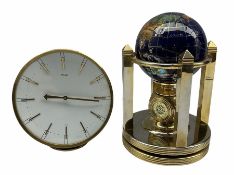 A globe desk clock with two battery driven clock dials