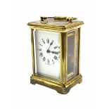 A late 19th century French Corniche cased 8-day timepiece carriage clock with a jewelled lever platf
