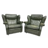 Pair of vintage green leather wing back armchairs
