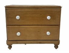 Victorian pine chest fitted with two deep drawers and ceramic pull handles