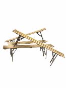 Set of four pine and steel folding trestle benches L168cm