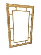 Ornate gilt framed wall mirror with beaded border and scrolled acanthus leaf decoration to frame 53