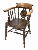 Late Victorian oak smokers bow armchair