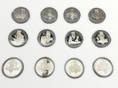 Twelve silver Alderney five pound coins