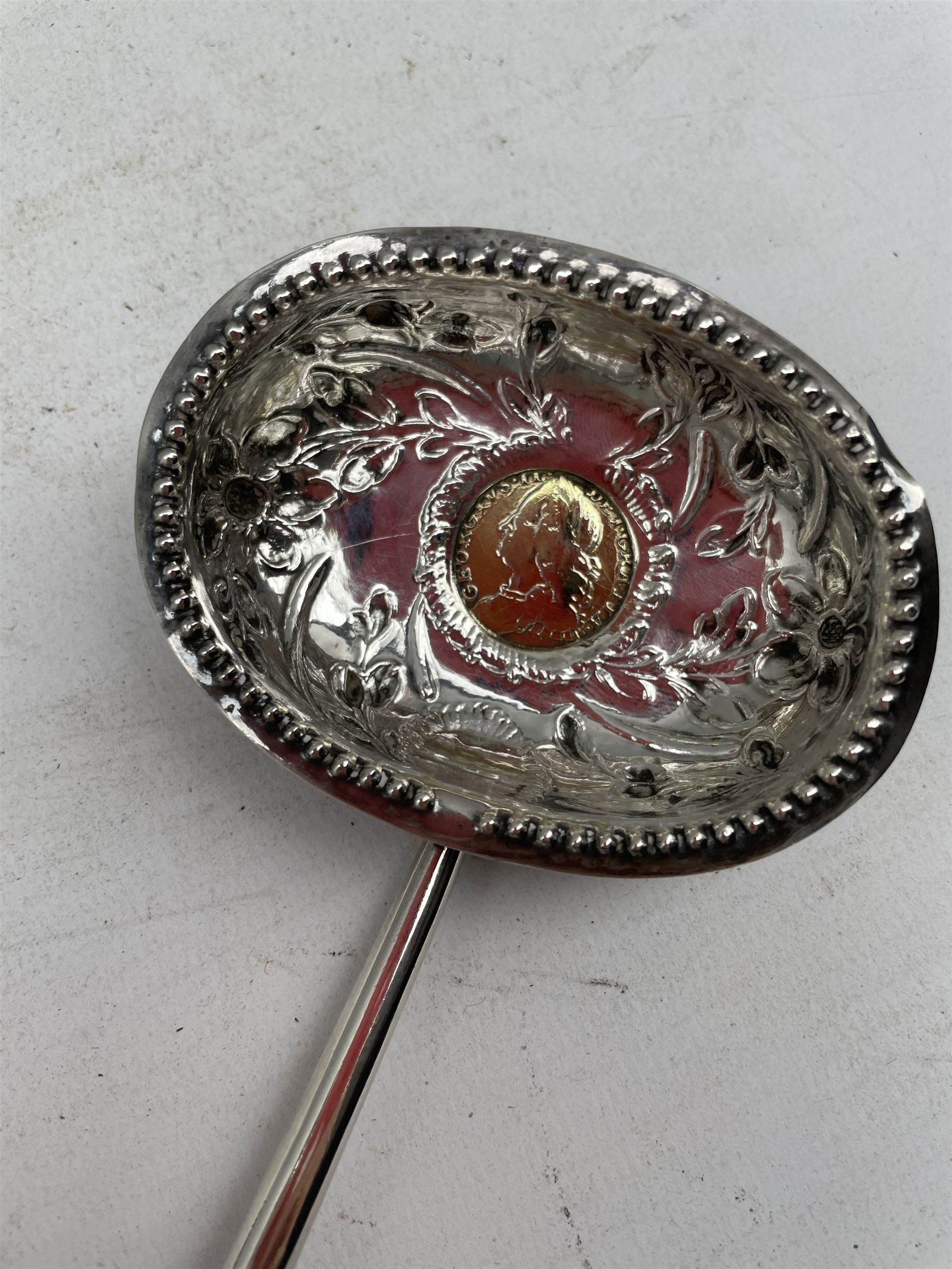 George III silver punch ladle with later embossed oval bowl inset with a silver shilling and with tw - Image 2 of 3