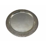 Asian white metal salver with scroll moulded border D30cm marked 'Pak 94 Sil' 19.5oz