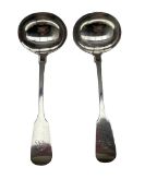 Pair of Victorian silver fiddle pattern sauce ladles engraved with a monogram London 1858 Maker Eman