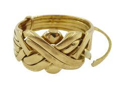 Gold puzzle ring stamped 18K