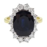 18ct gold oval sapphire and round brilliant cut diamond cluster ring