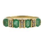 9ct gold four stone oval emerald and six stone diamond ring