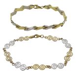 White and yellow gold swirl design link bracelet and one other gold link bracelet