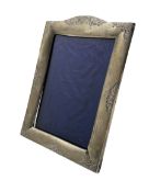 Silver upright photograph frame with engraved decoration and easel stand aperture size 14cm x 9.5c