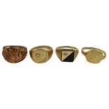 Gold black onyx and diamond chip signet ring and three other signet rings