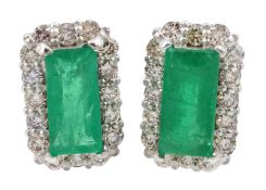 Pair of 18ct white gold emerald and round brilliant cut diamond cluster stud earrings