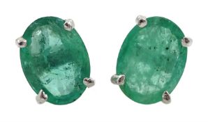 Pair of silver oval emerald stud earrings