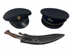 Kukri in scabbard with one skinning knife and 1980s French and Belgian police peaked caps