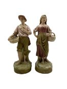 Pair of Royal Dux standing figures of male and female fish sellers