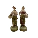 Pair of Royal Dux standing figures of male and female fish sellers