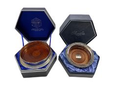 Stuart crystal silver-plated and mahogany bottle coaster and another by Barker Ellis