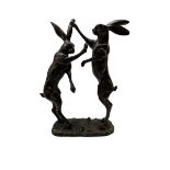 Bronze figure group modelled as two boxing hares