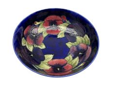 Moorcroft Pansy pattern pedestal bowl on a dark blue ground and with blue signature mark D26cm (a/f)