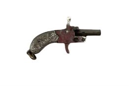 Miniature nickel .22 pin fire single shot pistol with engraved grip and suspension ring to the butt