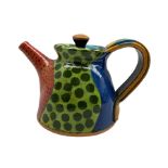 John Pollex (British 1941-): Studio pottery teapot slip decorated with painted geometric design
