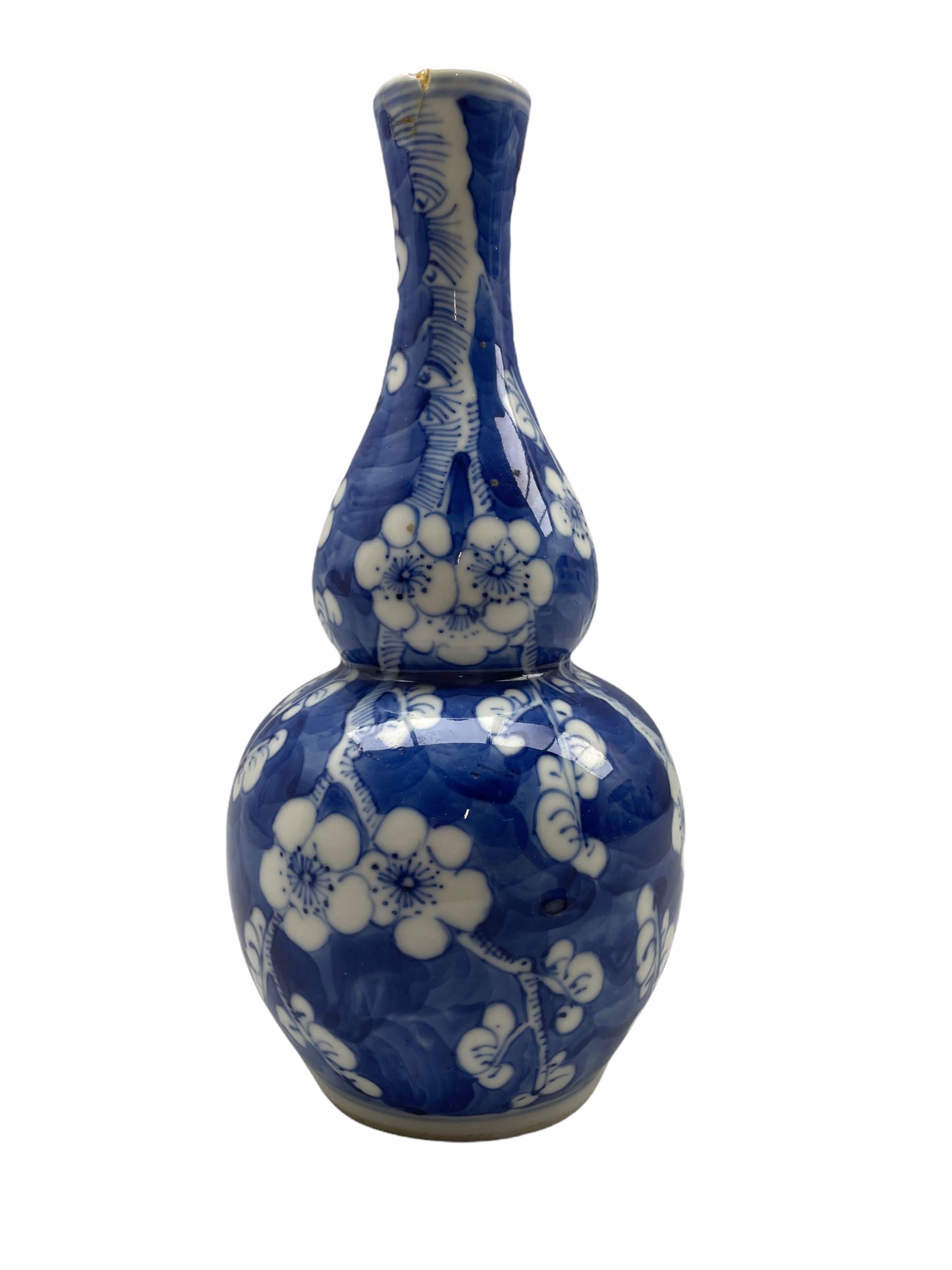 19th/ early 20th century Chinese gourd shape vase decorated with prunus in blue and white with four - Image 2 of 4