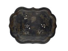 19th century black lacquer papier mache tray of lobed oval form decorated with a landscape and shell