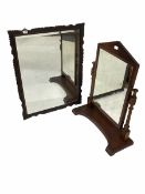 19th century dressing swing mirror with arched pediment over turned and fluted supports on a shaped