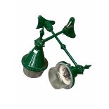 Near pair of green painted cast iron street lights with domed glass lampshades and concave wall brac