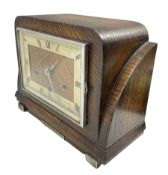 An oak cased German Art Deco 20th century three train Westminster chiming mantle clock striking the