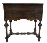Early 20th century Queen Anne style cross banded bow front walnut writing table with slide and two d