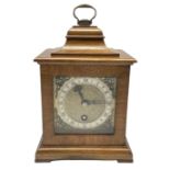 A small mid-20th century mantle clock in the style of an 18th century bracket clock