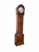 Late 19th century figured mahogany longcase clock with a lancet-shaped hood and stopped reeded pilla