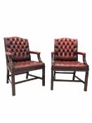 Pair of George III style library open armchairs