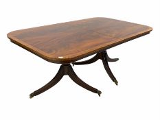 Large Regency style mahogany twin pillar dining table