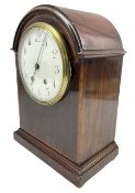 An Edwardian mahogany mantle clock with a break arch top