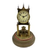 An early 20th century German torsion pendulum clock manufactured by Gustav Becker