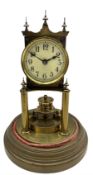 An early 20th century German torsion pendulum clock manufactured by Gustav Becker