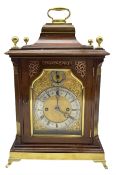 A late 19th century Mahogany Bracket clock with a brass handle to the bell top pediment