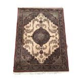 Persian design ground rug with floral medallion on beige field
