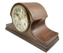 An early 20th century German mantle clock in a mahogany veneered Tambour case with mother of pearl i