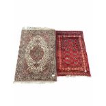 Hand knotted Bokhara red ground rug with gul motif and boarded (96cm x 164cm)