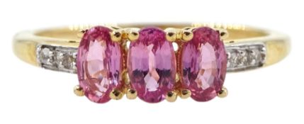9ct gold three stone oval pink sapphire ring