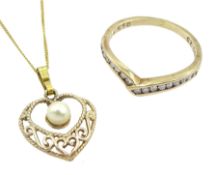 Gold channel set diamond wishbone ring and a gold pearl heart pendant necklace