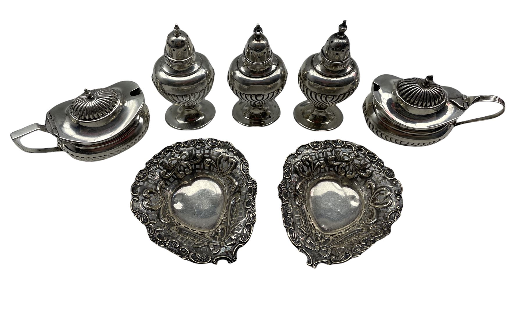 Late Victorian silver condiment set comprising three vase shape pepperettes and a pair of mustard po - Image 2 of 2