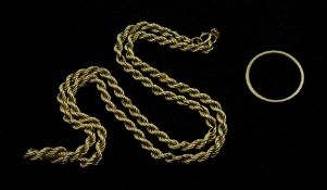 Gold rope twist necklace and a gold wedding band