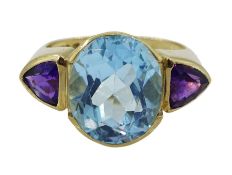 9ct gold three stone oval blue topaz and trillion cut amethyst ring